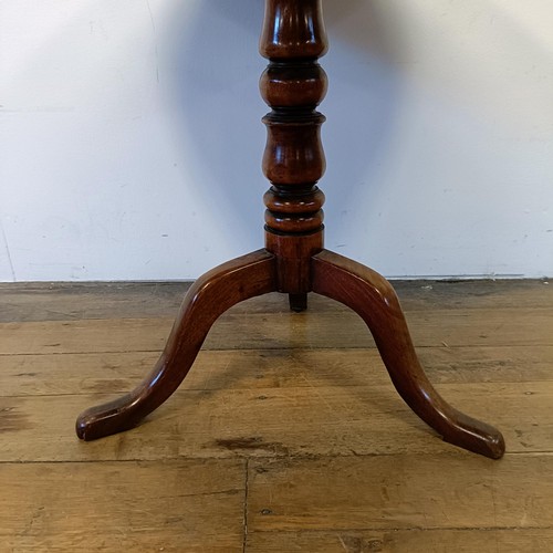 1245 - A 19th century mahogany tilt top table, on a column support tripod base, 80 cm wide, wall lights and... 