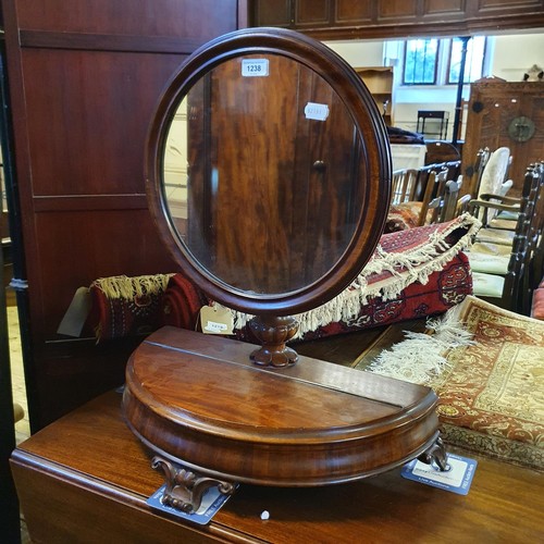 1238 - A 19th century mahogany bedroom mirror, the base with a hinged compartment, 66 cm high x 57 cm wide