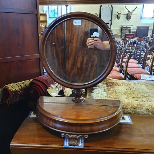 1238 - A 19th century mahogany bedroom mirror, the base with a hinged compartment, 66 cm high x 57 cm wide