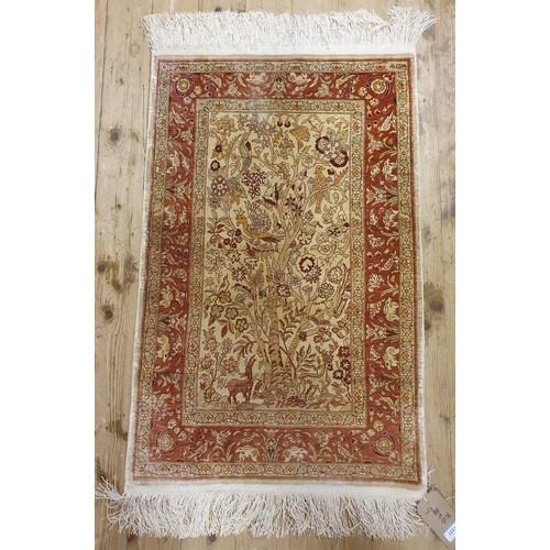 1337 - A Persian silk rug, 104 x 65 cm