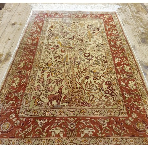 1337 - A Persian silk rug, 104 x 65 cm