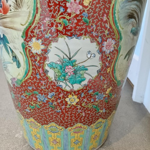 41 - A large pair of Chinese floor vases, of baluster form, decorated flowers and birds in enamel colours... 