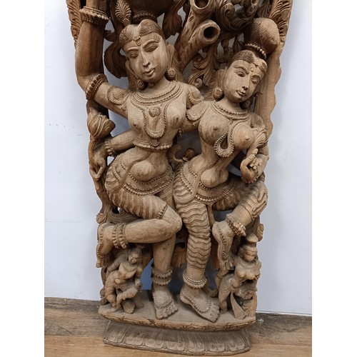 1035A - A large Indonesian wall carving, of four female figures, 155 x 70 cm