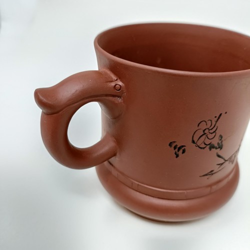 1036A - A Chinese Yixing teapot, character mark to base, 11 cm diameter, and a similar mug