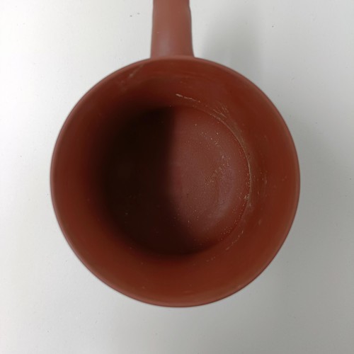 1036A - A Chinese Yixing teapot, character mark to base, 11 cm diameter, and a similar mug