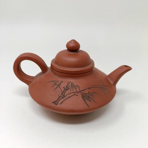 1036A - A Chinese Yixing teapot, character mark to base, 11 cm diameter, and a similar mug