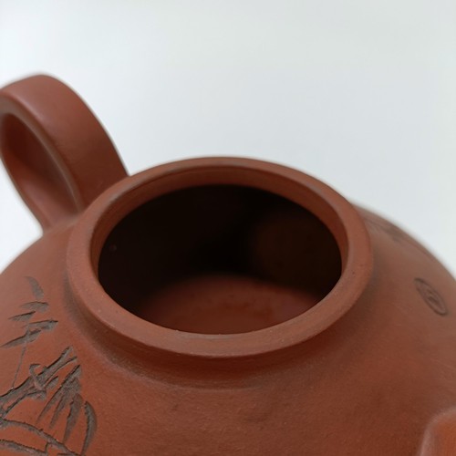 1036A - A Chinese Yixing teapot, character mark to base, 11 cm diameter, and a similar mug