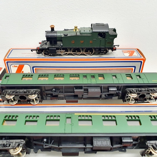 228 - A Lima OO gauge 2-6-2 locomotive, No 20 5111MW, and five Lima carriages, Nos 30 5314W, 30 5334W, 30 ... 