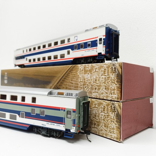 279 - A Chinese HO gauge two car carriage set, (2) (box)  Provenance: From a vast single owner collection ... 