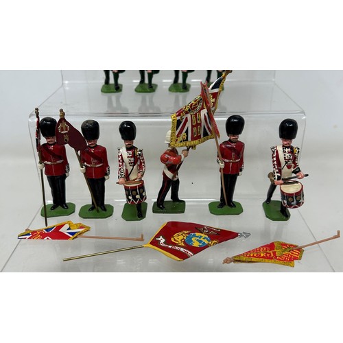 306 - A Britains military band set, and two others (3)