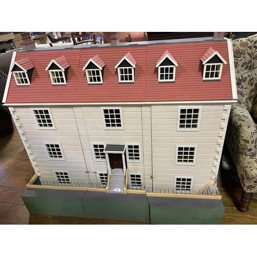 392 - A 20th century Georgian style dolls house, 130 cm wide x 100 cm high  
Provenance:  Built by the cur... 