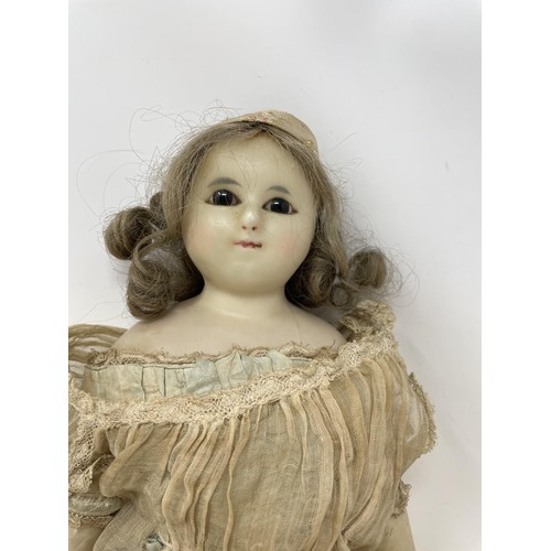 391 - A late 19th century wax head doll, 45 cm