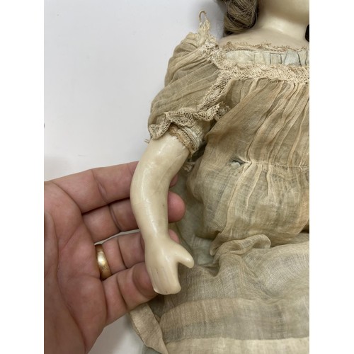 391 - A late 19th century wax head doll, 45 cm