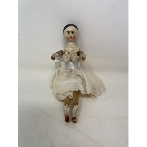 389 - A Grodnertal style painted wood doll, 15 cm, another, and two bisque head dolls (4)