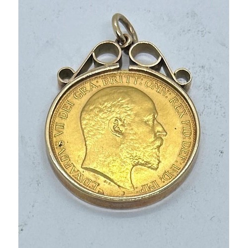 633 - An Edward VII gold double sovereign, 1902, in an  yellow metal mount (unmarked)