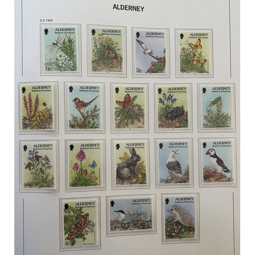 677 - A large group of Guernsey mint and other assorted stamps, in albums and loose (box)