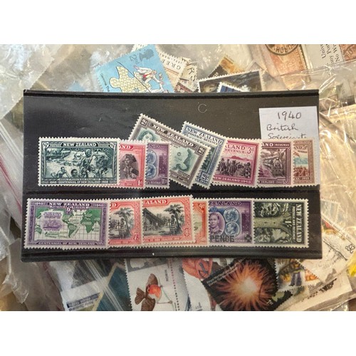 680 - A large group of assorted world stamps, presentation packs, first day covers, and other related item... 