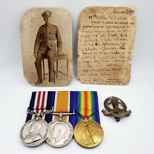 411 - A group of three medals awarded to 206176 Pte W E Biggs 23rd Middlesex Regiment, comprising a Milita... 