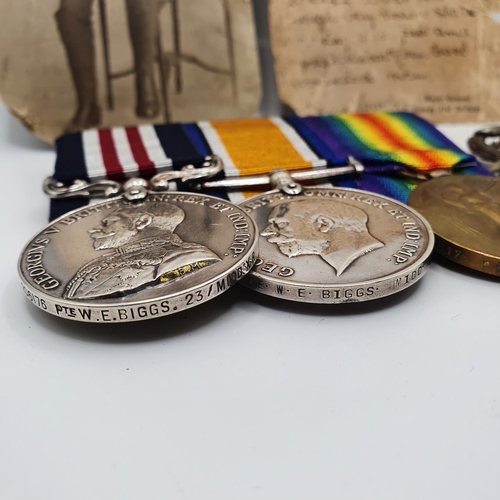 411 - A group of three medals awarded to 206176 Pte W E Biggs 23rd Middlesex Regiment, comprising a Milita... 