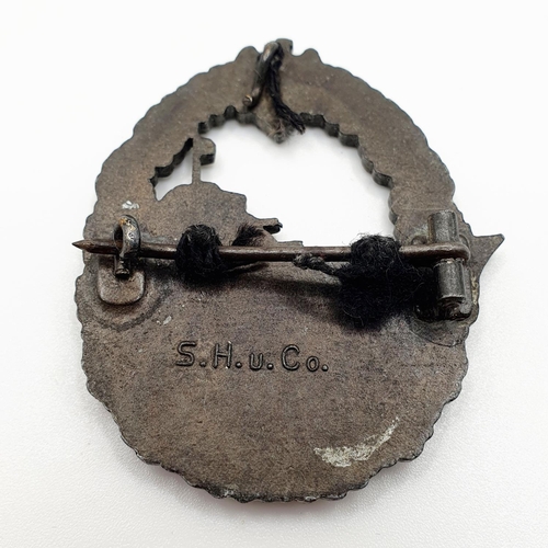 480 - A German WWII era Kriegsmarine badge, marked S.H.u.Co. to the reverse  
Provenance: From a collectio... 