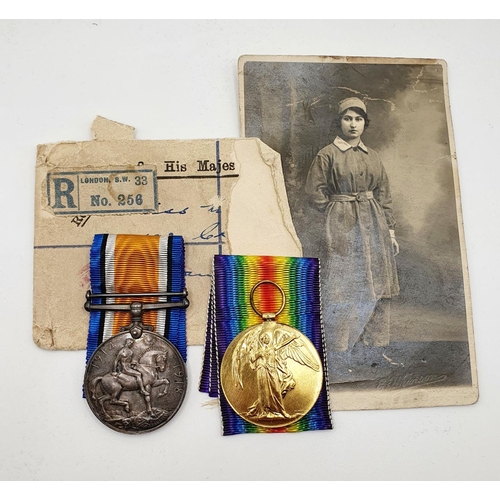 484 - A British War medal and Victory medal pair, awarded to 322 Wkr M L Neilson QMAAC, and a photograph P... 