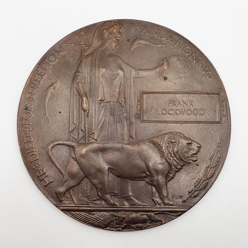 491 - A WWI bronze death plaque, Frank Lockwood  
Provenance: From a collection of medals and militaria am... 