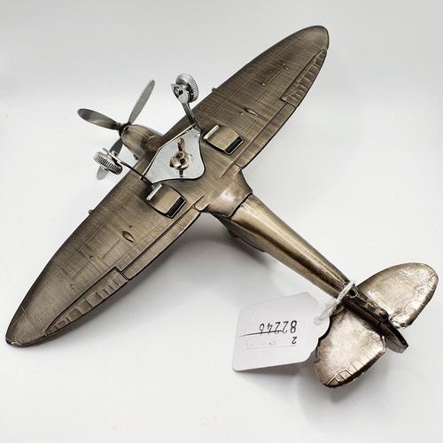 528 - A table lighter, in the form of a Spitfire Mk9, tail end section repaired, 19.5 cm long