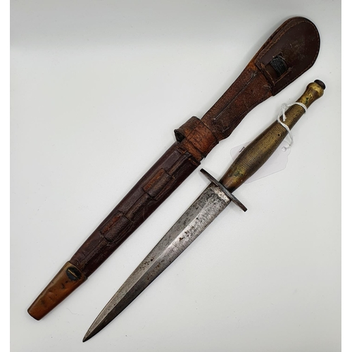 551 - A Fairbairn & Sykes Type 2 fighting knife, the blade engraved for Wilkinson Sword London and The F-S... 