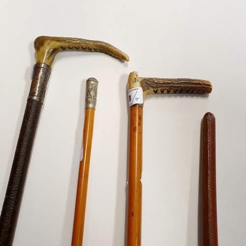 558 - A Royal Sussex Regiment swagger stick, a leather swagger stick, a riding crop and a riding whip (4)