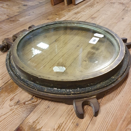 560 - A ship's bronze porthole, 35 cm diameter