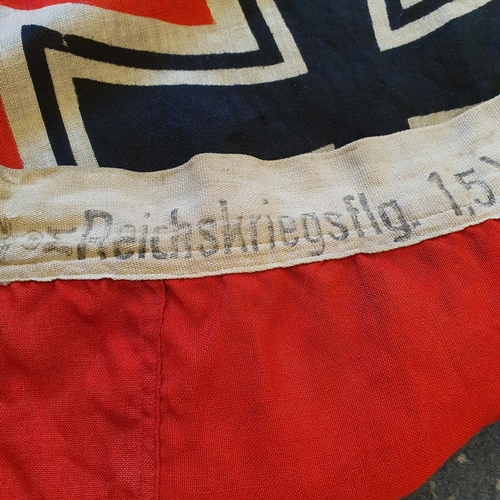 561 - A German Kriegsmarine flag, 137 x 247 cm, marked Reichskriegsflag 1.5 x 2.5 and with an eagle above ... 