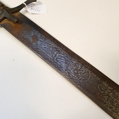 568 - A Persian sword, the 89 cm blade with script, and with a leather bound handle, general surface rust,... 