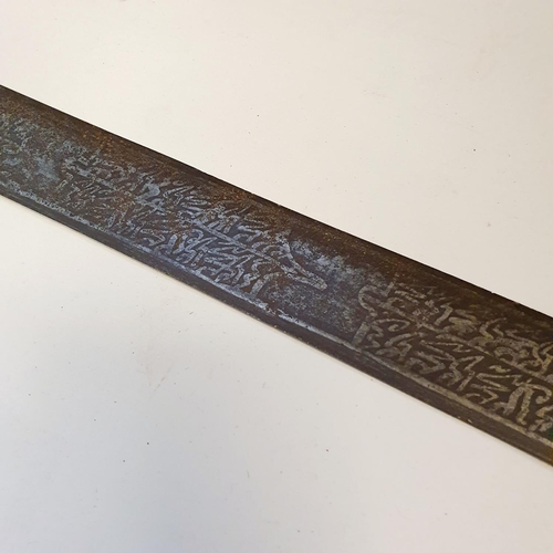 568 - A Persian sword, the 89 cm blade with script, and with a leather bound handle, general surface rust,... 