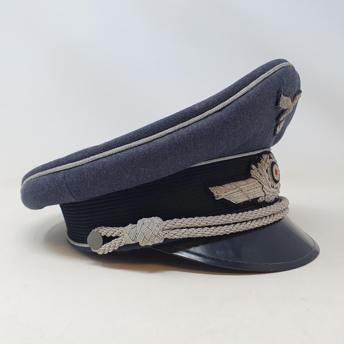 577 - A German WWII era Luftwaffe Officer Ranks visor cap, the brim with Erel makers stamp, appears to be ... 