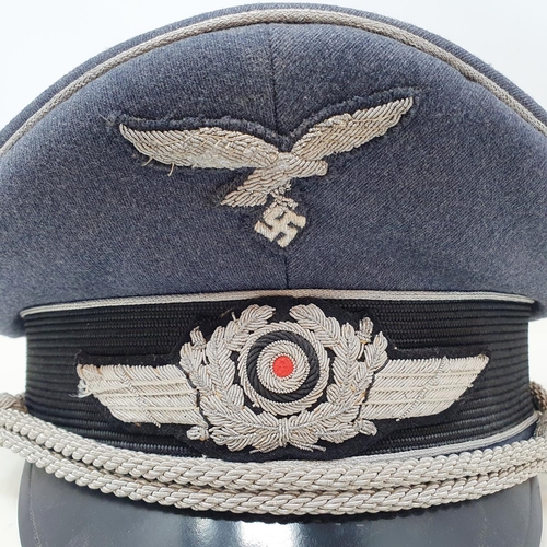 577 - A German WWII era Luftwaffe Officer Ranks visor cap, the brim with Erel makers stamp, appears to be ... 