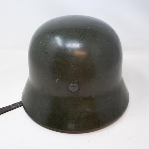 578 - A German WWII era M1935 Heer double decal helmet, the liner band is date 1938 and is a size 58, the ... 