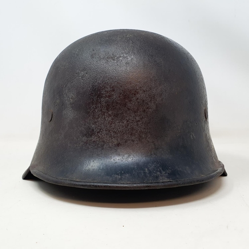 579 - A German steel helmet, the inside painted K Cramer Bollberge Halla S, understood to be a doctor in B... 