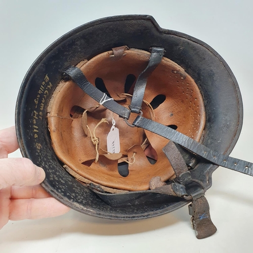 579 - A German steel helmet, the inside painted K Cramer Bollberge Halla S, understood to be a doctor in B... 