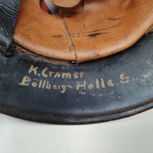 579 - A German steel helmet, the inside painted K Cramer Bollberge Halla S, understood to be a doctor in B... 