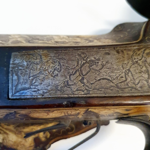 581 - A fine 17th century German wheel lock rifle, having an octagonal barrel of approx. 18 mm and having ... 