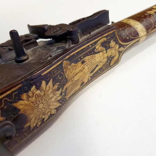 581 - A fine 17th century German wheel lock rifle, having an octagonal barrel of approx. 18 mm and having ... 