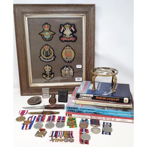 592 - Assorted military buttons, badges, miniature medals, books and related items (qty)