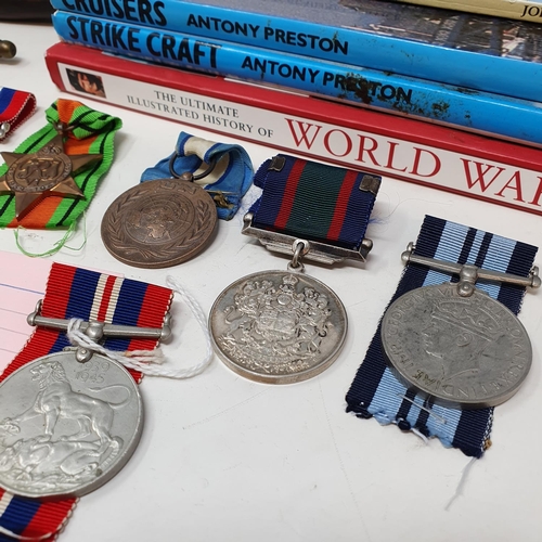 592 - Assorted military buttons, badges, miniature medals, books and related items (qty)