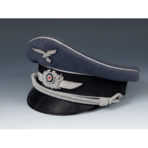 577 - A German WWII era Luftwaffe Officer Ranks visor cap, the brim with Erel makers stamp, appears to be ... 