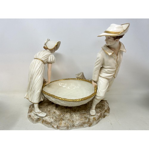 1019 - A Royal Worcester comport, on figural mounts, and two others similar (3)