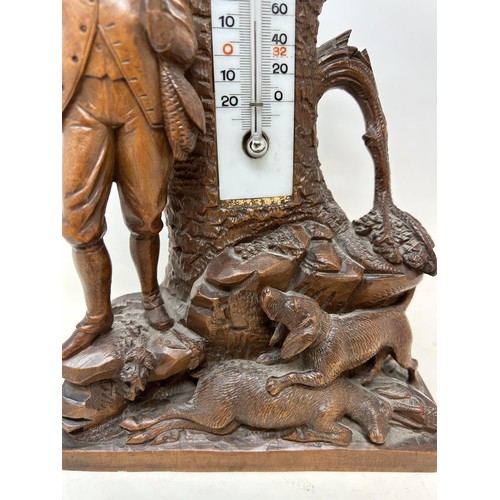 1029 - A Black Forest style desk top thermometer, 33 cm high