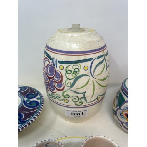 1081 - A Poole Pottery posy ring, 13 cm diameter, a Poole Pottery lamp base, a preserve jar and cover, cove... 