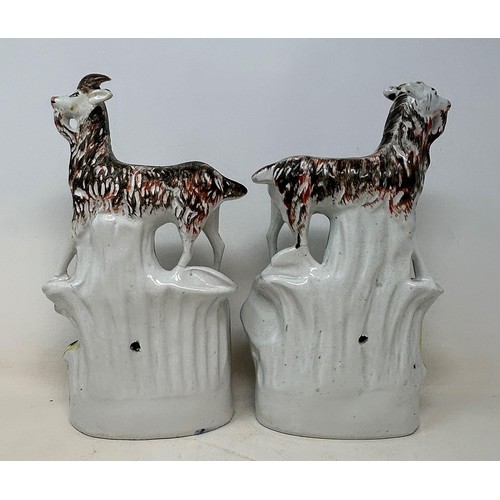 1091 - A pair of 19th century Staffordshire flatbacks, in the form of goats above a sleeping couple, 29 cm ... 