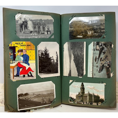 1098 - Two albums of postcards, the smaller red album to include assorted military cards (2)