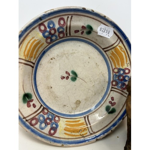 1093 - A Chinese famille rose plate, decorated flowers and fruit, star crack to base, 22 cm diameter, two o... 